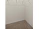 Carpeted empty walk-in closet space featuring base trim at 8899 Sw 50Th Ave, Ocala, FL 34476