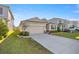 Well-maintained home with a spacious driveway and manicured lawn in a desirable neighborhood at 8899 Sw 50Th Ave, Ocala, FL 34476