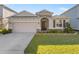 Charming single-Gathering home featuring a two-car garage and beautifully landscaped front yard at 8899 Sw 50Th Ave, Ocala, FL 34476
