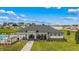 Poolside cabana area including plenty of seating, shade, and barbecue equipment at 8899 Sw 50Th Ave, Ocala, FL 34476