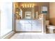 Well-lit bathroom with a double vanity, modern fixtures, and a glass-enclosed shower for a clean design at 9458 Sw 93Rd Loop, Ocala, FL 34481