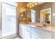 Beautiful bathroom equipped with a double sink vanity, walk-in shower and neutral color paint at 9458 Sw 93Rd Loop, Ocala, FL 34481