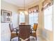Lovely dining area with natural light, a chandelier, and seating for four at 9458 Sw 93Rd Loop, Ocala, FL 34481