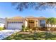 Charming single-Gathering home with a manicured lawn and inviting curb appeal on a bright, sunny day at 9458 Sw 93Rd Loop, Ocala, FL 34481