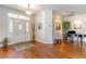 Welcoming foyer with hardwood flooring, decorative lighting, and an open floor plan at 9458 Sw 93Rd Loop, Ocala, FL 34481