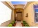 Inviting front entrance with decorative door, sidelights, and manicured landscaping at 9458 Sw 93Rd Loop, Ocala, FL 34481