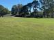 Picturesque view of the green golf course, with manicured fairways and lush landscaping at 9458 Sw 93Rd Loop, Ocala, FL 34481