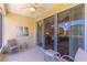 Relax on this screened lanai, featuring tile floors and sliding glass doors, perfect for enjoying the outdoors at 9458 Sw 93Rd Loop, Ocala, FL 34481