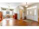Spacious open room with hardwood flooring, ceiling fan, and natural light at 9458 Sw 93Rd Loop, Ocala, FL 34481