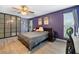 Relaxing bedroom featuring a comfortable bed, modern decor, and abundant natural light at 12453 Se 61St Ct, Belleview, FL 34420