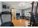 Spacious exercise room featuring fitness equipment, decor, and lots of natural light at 12453 Se 61St Ct, Belleview, FL 34420