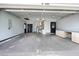 Spacious two-car garage with ample storage, utility sink and overhead lighting at 12453 Se 61St Ct, Belleview, FL 34420