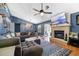 Bright living room featuring a fireplace, ample natural light, and contemporary decor at 12453 Se 61St Ct, Belleview, FL 34420