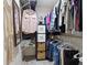 This is a walk-in closet offering storage and organization with shelves and clothing racks at 12453 Se 61St Ct, Belleview, FL 34420