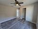 Bedroom features gray floors, neutral paint, and closet at 13 Locust Trak, Ocala, FL 34472