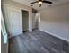 Bedroom features include gray flooring, neutral paint, a window, and a closet at 13 Locust Trak, Ocala, FL 34472
