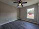 Bedroom features include gray flooring, neutral paint, and a window view at 13 Locust Trak, Ocala, FL 34472
