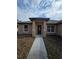 Walkway leading to the front door framed by columns and windows at 13 Locust Trak, Ocala, FL 34472