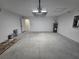 Bright, two-car garage with water heater, electrical panel, and access door to the interior at 13 Locust Trak, Ocala, FL 34472