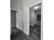 Hallway features gray floors, neutral paint, and an entry to the garage at 13 Locust Trak, Ocala, FL 34472