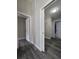 Hallway featuring multiple doorways and modern floors at 13 Locust Trak, Ocala, FL 34472