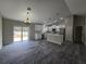 Open-concept kitchen with white cabinetry, an island, and stainless steel appliances at 13 Locust Trak, Ocala, FL 34472