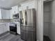Updated kitchen featuring stainless steel appliances and ample storage at 13 Locust Trak, Ocala, FL 34472
