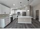 Well-appointed kitchen featuring an island and modern stainless steel appliances at 13 Locust Trak, Ocala, FL 34472