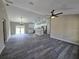 Expansive living room flowing into a modern kitchen with stainless steel appliances at 13 Locust Trak, Ocala, FL 34472