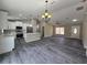Bright and airy open-concept living space featuring a kitchen and dining area at 13 Locust Trak, Ocala, FL 34472