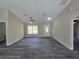 Bright living room showcasing wood-look flooring and a neutral color palette at 13 Locust Trak, Ocala, FL 34472