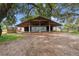 Open-air horse shelter with sturdy construction, offering protection from the elements and a place for horses to relax at 13800 Ne Jacksonville Road, Citra, FL 32113