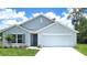 Charming single-Gathering home features a well-manicured lawn and attached two-car garage at 14781 Sw 22Nd Court Rd, Ocala, FL 34473