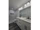 Bathroom features double vanity, modern fixtures, and marble-tiled shower at 17 Laurel Pass Ln, Ocala, FL 34480
