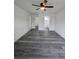 Spacious bedroom with multiple entryways, neutral walls, and sleek gray flooring at 17 Laurel Pass Ln, Ocala, FL 34480