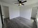Large bedroom features luxury vinyl plank flooring, ceiling fan, and two doorways at 17 Laurel Pass Ln, Ocala, FL 34480