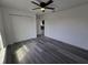 Bedroom with luxury vinyl plank flooring, a ceiling fan, and closet for storage at 17 Laurel Pass Ln, Ocala, FL 34480