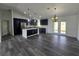 Open kitchen featuring an island with pendant lights, stainless steel appliances, and modern countertops at 17 Laurel Pass Ln, Ocala, FL 34480