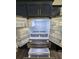 A modern refrigerator with a water dispenser is surrounded by navy kitchen cabinets at 17 Laurel Pass Ln, Ocala, FL 34480