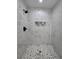 Walk-in shower features stylish mosaic accents and sleek gray flooring at 17 Laurel Pass Ln, Ocala, FL 34480