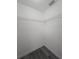 Walk-in closet with wire shelving, gray flooring, and white walls provides practical storage solutions at 17 Laurel Pass Ln, Ocala, FL 34480