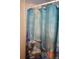 Bathroom with a shower curtain with dolphin and fish artwork at 1764 Se 169Th Avenue Rd, Silver Springs, FL 34488