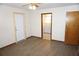 Bedroom with adjacent bath features vinyl flooring and neutral walls at 1764 Se 169Th Avenue Rd, Silver Springs, FL 34488