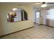 An archway looks through to an open concept kitchen with wood cabinetry at 1764 Se 169Th Avenue Rd, Silver Springs, FL 34488