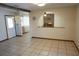 Open-concept living room features tile floors and an archway through to the fireplace at 1764 Se 169Th Avenue Rd, Silver Springs, FL 34488