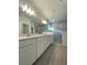 Modern bathroom with double vanity, sleek countertops, and a glass-enclosed shower for a spa-like experience at 19444 Sw 78Th Pl, Dunnellon, FL 34432