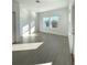 Bright and airy bedroom with tile floors, neutral walls, and a large window for natural light at 19444 Sw 78Th Pl, Dunnellon, FL 34432