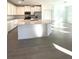 Modern kitchen with stainless steel appliances, ample counter space, and a large center island at 19444 Sw 78Th Pl, Dunnellon, FL 34432