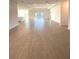 Expansive living room featuring sleek tile flooring, recessed lighting, and an abundance of natural light at 19444 Sw 78Th Pl, Dunnellon, FL 34432