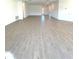 Vast living room featuring sleek tile flooring, recessed lighting, and a bright and airy atmosphere at 19444 Sw 78Th Pl, Dunnellon, FL 34432